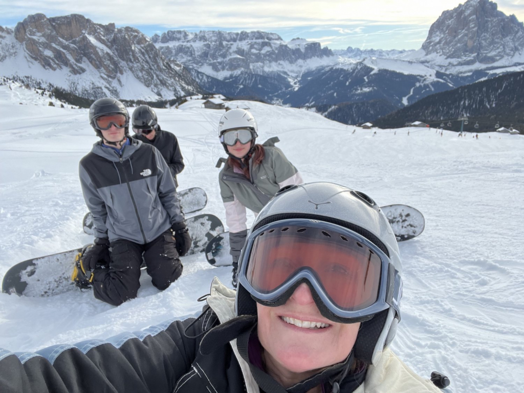 Deborah snowboarding with her three children